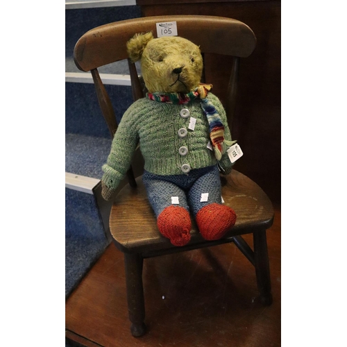 105 - Vintage filled teddy bear with knitted costume, together with a small beech and elm child's chair. (... 