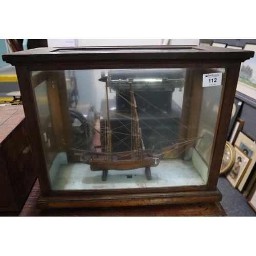 112 - Hand made wooden two masted ship model contained in  glazed spring balance case. 
(B.P. 24% incl. VA... 