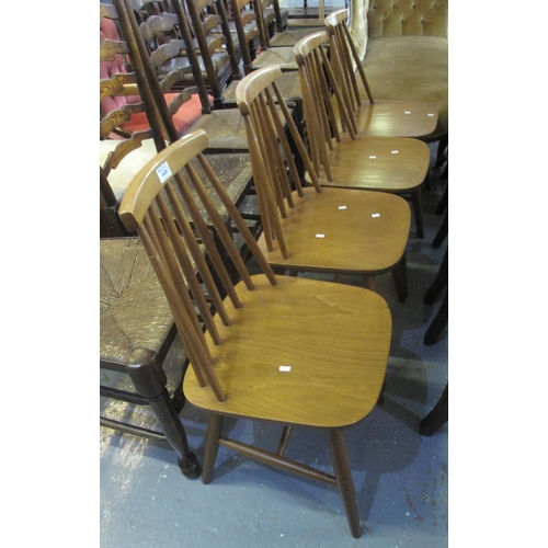 449 - Set of four beech Ercol style spindle back kitchen chairs, unmarked. (4)
(B.P. 24% incl. VAT)