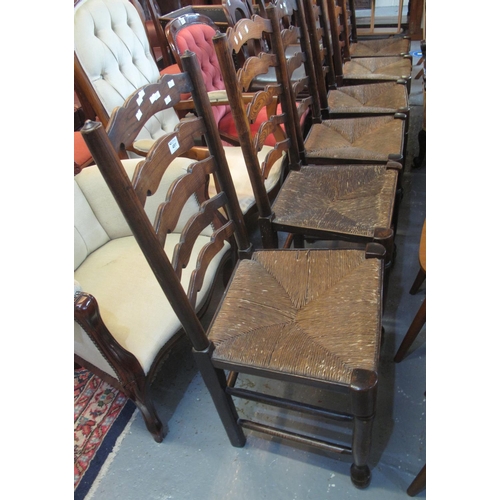 451 - Set of six Lancashire style elm ladder back kitchen chairs with rush seats. (6)
(B.P. 24% incl. VAT)