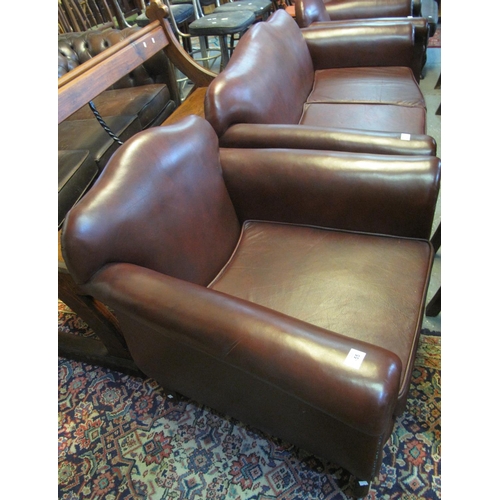 455 - Modern burgandy leather three piece suite comprising two seater sofa and a pair of armchairs. (3)
(B... 