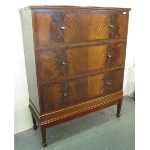 473 - Mid Century mahogany tall boy having three large straight fronted drawers on tapering legs and spade... 