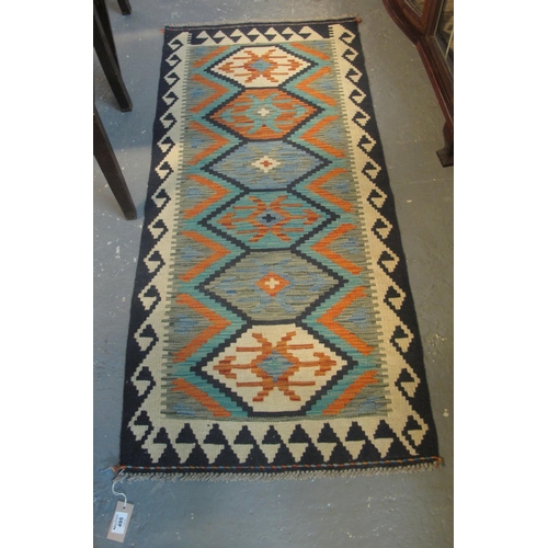 495 - Chobi Kelim geometric multi-coloured runner. 144 x 66cm approx.
(B.P. 24% incl. VAT)