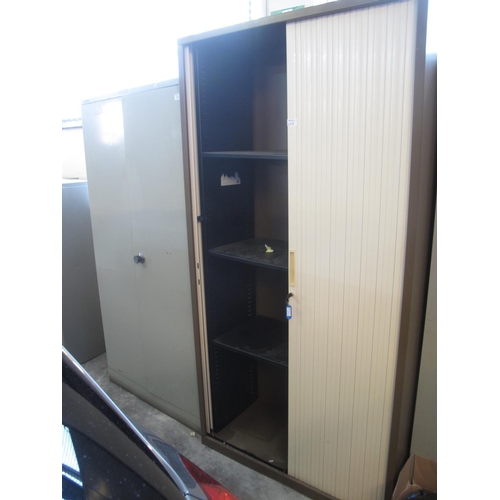 510 - Metal two door filing cabinet, together with another filing cabinet with tambour front. (2)
(B.P. 24... 