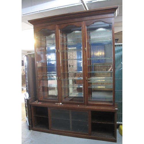 514 - Early 20th Century mahogany two stage display cabinet with mirrored back and glass adjustable shelve... 