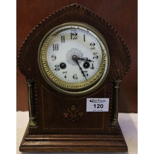 120 - Edwardian inlaid lancet shaped two train mantel clock. Includes key.
(B.P. 24% incl. VAT)