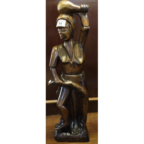 82 - Modern carved tribal wooden study of a lady with club on her head. 
(B.P. 24% incl. VAT)