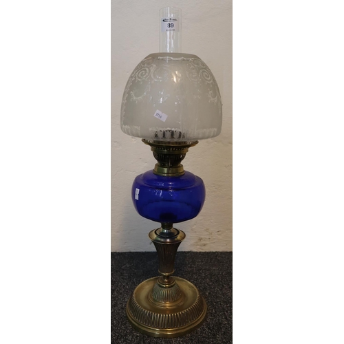 89 - Early 20th Century double burner oil lamp having frosted and clear glass etched foliate shade, blue ... 