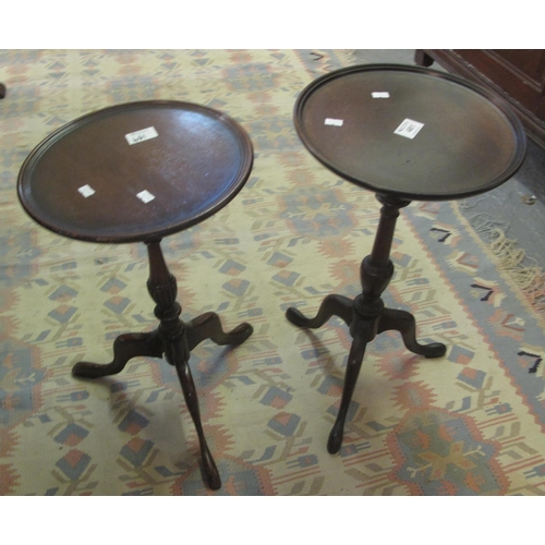 481 - Two similar small mahogany tripod wine tables. (2)
(B.P. 21% + VAT)