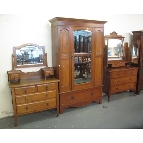 501 - Early 20th Century oak bedroom suite comprising; mirrored two stage wardrobe and a triple mirrored b... 