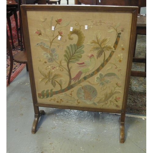 507 - Early 20th Century firescreen on stand depicting exotic bird amongst foliage. 
(B.P. 21% + VAT)