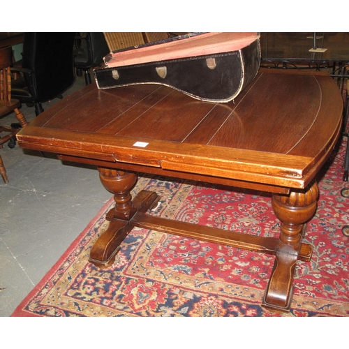 520 - Early 20th Century oak draw leaf dining table on fluted supports and stretchers. 
(B.P. 21% + VAT)