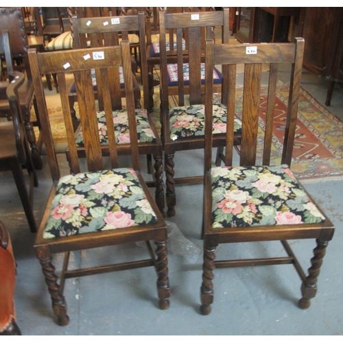 530 - A set of four early 20th Century slat back dining chairs with tapestry drop in seats, standing on ba... 