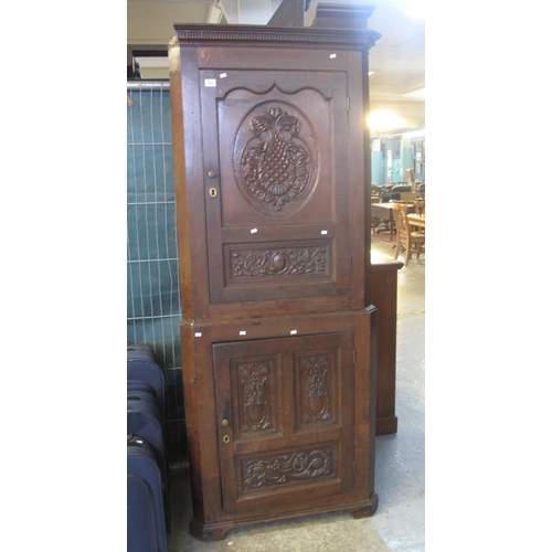 559 - 17th Century style oak two stage carved blind panelled corner cabinet.
(B.P. 21% + VAT)