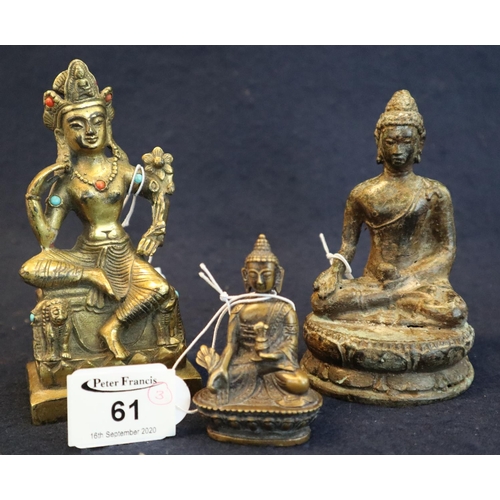 61 - 3 probably Tibetan yellow metal Buddha figures. The largest within inset cabuchon coloured stones al... 