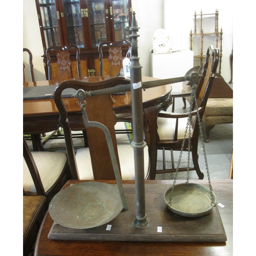 506 - Set of 19th century brass pillar shop balance scales on mahogany base.
(B.P. 21% + VAT)