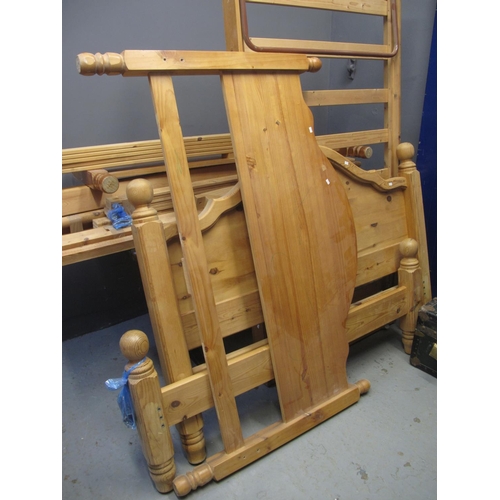 520 - Two pairs of pine double bed steads with side rails and slats, together with a pull-out pine single ... 