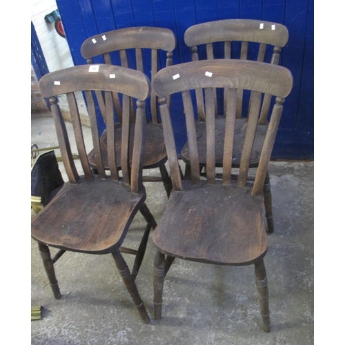 524 - Similar set of four stained slat backed Windsor type kitchen chairs on ring turned baluster legs. (4... 