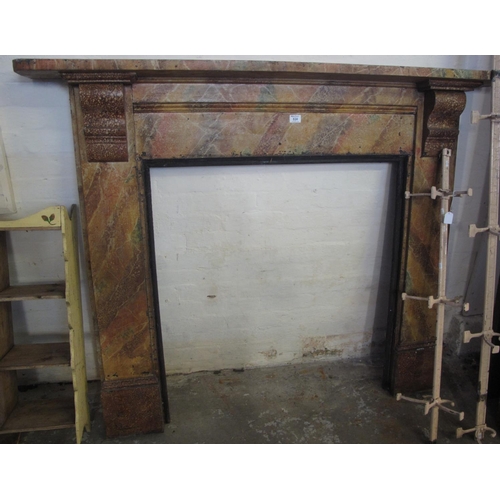 526 - Simulated marble, black wooden fire surround with mantel shelf on scroll corbels. Opening is 88 cm a... 