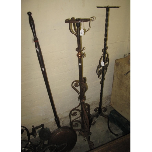 535 - 19th century copper warming pan, wrought iron standard lamp, and a wrought iron torchere stand, toge... 