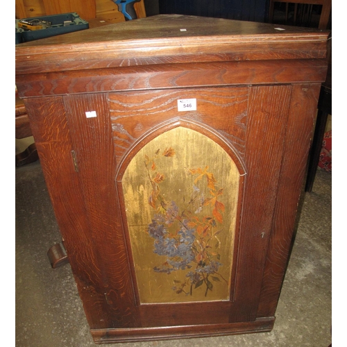 546 - Oak blind hanging corner cupboard with painted foliate panel to the door and fitted shelves to the i... 