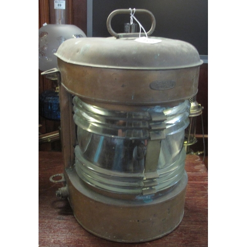 88A - A ship's brass, clear glass mast head lantern. With carrying handle. 43 cm high approx overall.
(B.P... 