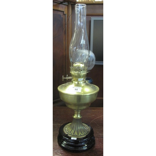 90 - Early 20th century brass double burner oil lamp with brass reservoir on fluted pedestal and ceramic ... 