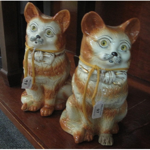 97 - Pair of 20th century Staffordshire pottery seated ginger cats with glass eyes. 32 cm high approx. (2... 