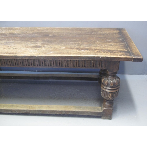 62 - ELIZABETHAN STYLE OAK REFECTORY TABLE with cleated five plank top above arcade frieze, standing on m... 