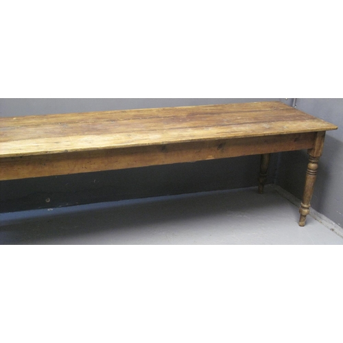 69 - 19TH CENTURY PINE FARMHOUSE KITCHEN TABLE of rectangular form with three plank top, above ring turne... 