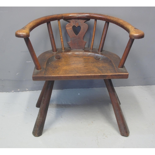 73 - PRIMITIVE OAK, ASH AND ELM HOOP BACKED ELBOW CHAIR with heart shaped splat moulded seat and tapering... 