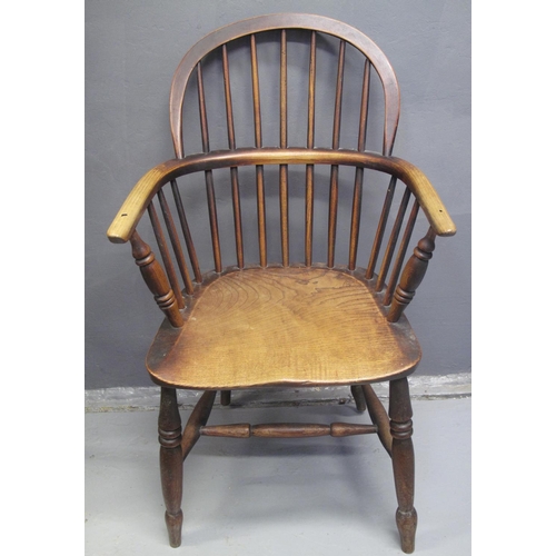 80 - 19TH CENTURY ASH AND ELM WINDSOR HOOP BACKED ELBOW CHAIR having moulded seat standing on baluster tu... 