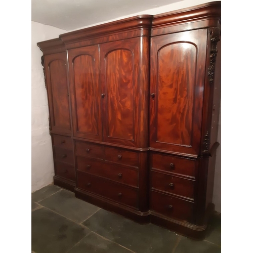 87 - VICTORIAN MAHOGANY BREAK FRONT WARDROBE having moulded cornice above four blind panelled arch moulde... 