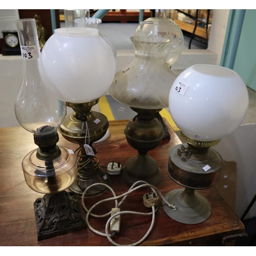 103 - A group of four brass oil lamps with shades, one converted to electricity. (4)
(B.P. 21% + VAT)