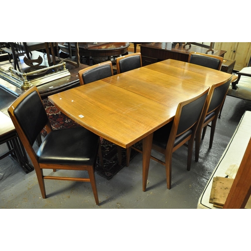 514 - 1960's teak dining table with a set of six matching dining chairs with leather finish backs and seat... 