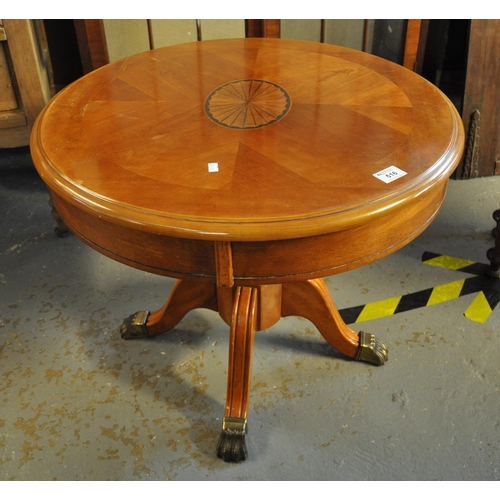 516 - Reproduction mahogany finish circular occasional table on quatraform base. 
(B.P. 21% + VAT)