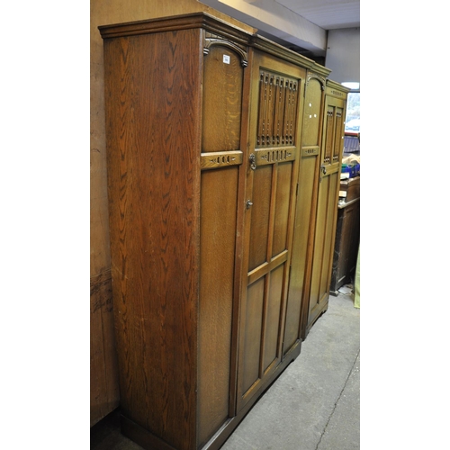 560 - Mid Century oak Old Charm style bedroom suite comprising large and small single door wardrobe. (2)
(... 