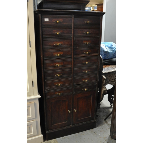 563 - Early 20th Century stained oak straight front filing cabinet having a bank of 16 drawers above two b... 