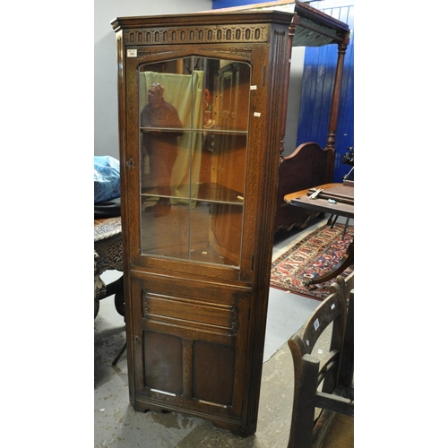 564 - 20th Century carved oak single door lead glazed corner cabinet.
(B.P. 21% + VAT)