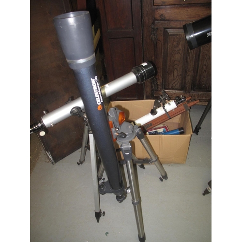 574 - Celestron Astromaster 70 telescope on stand, together with an Aspen telescope on stand and other acc... 