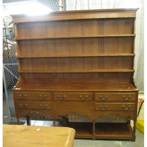 577 - 19th Century style oak rack back two stage pot board dresser having moulded cornice above three fitt... 