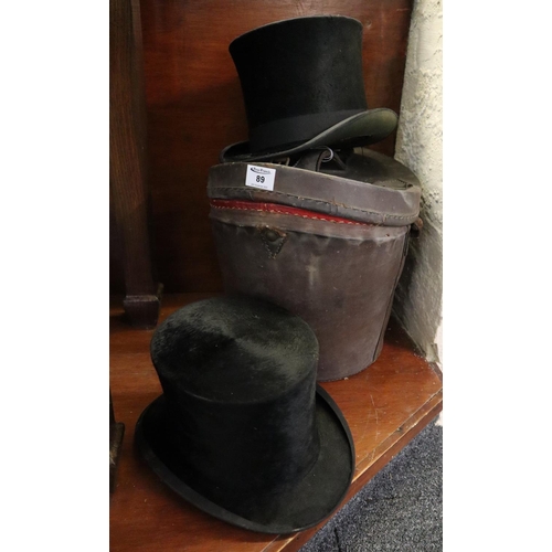 89 - Traditional leather oval section hat box with dished lid, together with two silk top hats. 
(B.P. 21... 