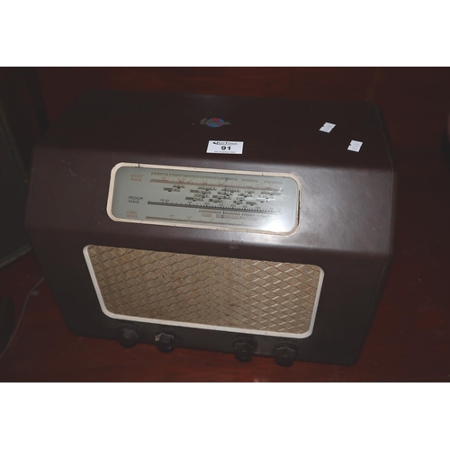 91 - G Marconi brown bakelite valve radio.
(B.P. 21% + VAT)