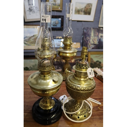 99 - Two oil lamps.
(B.P. 21% + VAT)