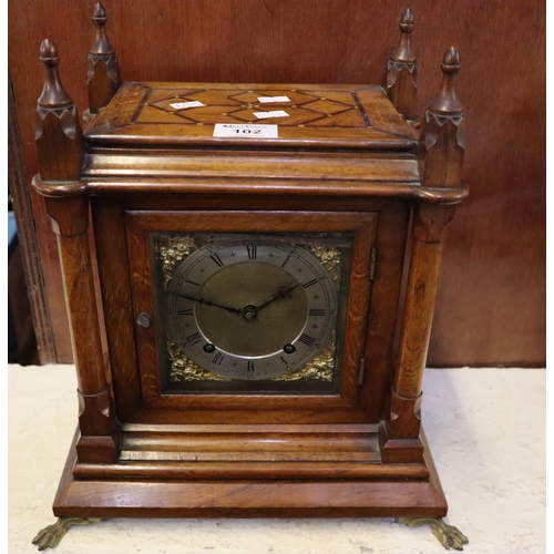 102 - 19th Century oak gothic design two train mantel clock having brass face with silvered chapter ring, ... 