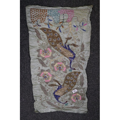 109 - A silk embroidered panel probably Indian with peacock design and silver wire embroidery. 
(B.P. 21% ... 