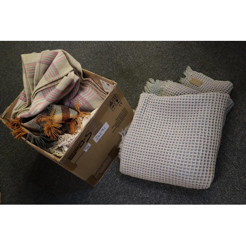 110 - Mixed box of textiles to include; a vintage woollen blue honeycomb blanket, two vintage woollen chec... 