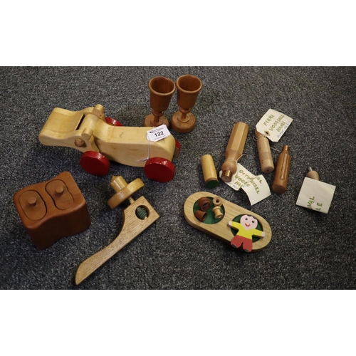 122 - A box containing a collection of modern treen items including; a toy hippo, drinking cups on stand, ... 