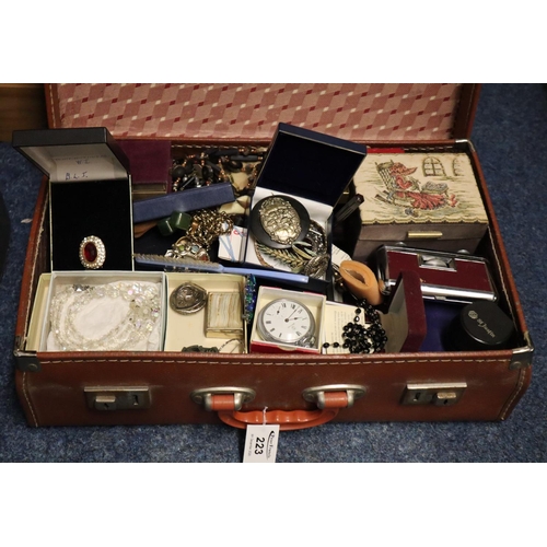 223 - Small suitcase containing assorted costume jewellery, pocket watch, opera glasses etc. 
(B.P. 21% + ... 