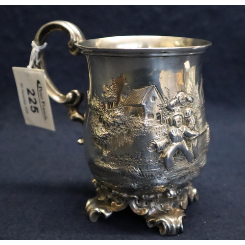 225 - 19th Century silver repousse baluster shaped mug with C scroll handle and pierced scrollwork feet, d... 